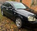 Черный Шевроле Лачетти, объемом двигателя 1.8 л и пробегом 250 тыс. км за 4200 $, фото 1 на Automoto.ua