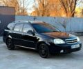 Черный Шевроле Лачетти, объемом двигателя 1.8 л и пробегом 1610 тыс. км за 4400 $, фото 1 на Automoto.ua
