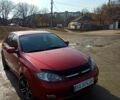 Красный Шевроле Лачетти, объемом двигателя 1.8 л и пробегом 235 тыс. км за 3800 $, фото 1 на Automoto.ua
