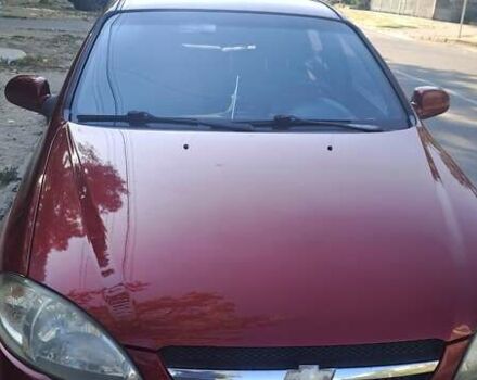 Красный Шевроле Лачетти, объемом двигателя 1.8 л и пробегом 280 тыс. км за 5700 $, фото 1 на Automoto.ua