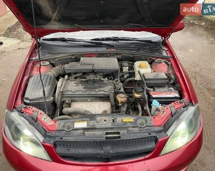 Красный Шевроле Лачетти, объемом двигателя 1.8 л и пробегом 121 тыс. км за 3750 $, фото 10 на Automoto.ua