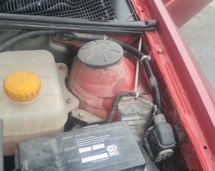 Красный Шевроле Лачетти, объемом двигателя 1.4 л и пробегом 259 тыс. км за 3500 $, фото 2 на Automoto.ua