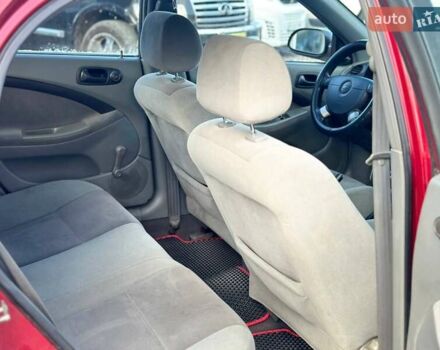 Красный Шевроле Лачетти, объемом двигателя 1.4 л и пробегом 200 тыс. км за 3200 $, фото 7 на Automoto.ua