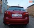 Красный Шевроле Лачетти, объемом двигателя 1.6 л и пробегом 261 тыс. км за 3650 $, фото 2 на Automoto.ua