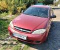 Красный Шевроле Лачетти, объемом двигателя 1.6 л и пробегом 303 тыс. км за 3300 $, фото 1 на Automoto.ua