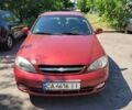 Красный Шевроле Лачетти, объемом двигателя 1.8 л и пробегом 300 тыс. км за 5000 $, фото 1 на Automoto.ua
