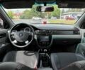 Красный Шевроле Лачетти, объемом двигателя 1.8 л и пробегом 256 тыс. км за 3900 $, фото 1 на Automoto.ua