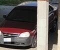 Красный Шевроле Лачетти, объемом двигателя 1.6 л и пробегом 300 тыс. км за 900 $, фото 1 на Automoto.ua