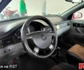 Красный Шевроле Лачетти, объемом двигателя 1.6 л и пробегом 220 тыс. км за 3500 $, фото 4 на Automoto.ua