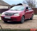 Красный Шевроле Лачетти, объемом двигателя 1.8 л и пробегом 265 тыс. км за 4200 $, фото 1 на Automoto.ua