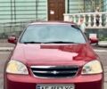 Красный Шевроле Лачетти, объемом двигателя 1.8 л и пробегом 380 тыс. км за 3700 $, фото 1 на Automoto.ua