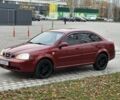 Красный Шевроле Лачетти, объемом двигателя 1.8 л и пробегом 230 тыс. км за 3550 $, фото 1 на Automoto.ua