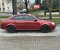 Красный Шевроле Лачетти, объемом двигателя 1.8 л и пробегом 230 тыс. км за 3550 $, фото 2 на Automoto.ua