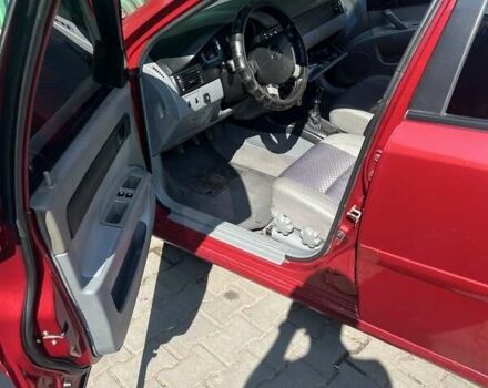 Красный Шевроле Лачетти, объемом двигателя 1.6 л и пробегом 370 тыс. км за 5000 $, фото 1 на Automoto.ua