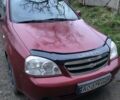 Красный Шевроле Лачетти, объемом двигателя 1.8 л и пробегом 250 тыс. км за 2700 $, фото 1 на Automoto.ua