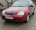 Красный Шевроле Лачетти, объемом двигателя 1.6 л и пробегом 235 тыс. км за 3850 $, фото 1 на Automoto.ua
