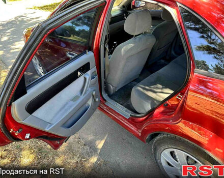 Красный Шевроле Лачетти, объемом двигателя 1.8 л и пробегом 185 тыс. км за 3900 $, фото 6 на Automoto.ua