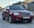 Красный Шевроле Лачетти, объемом двигателя 1.6 л и пробегом 295 тыс. км за 2950 $, фото 1 на Automoto.ua