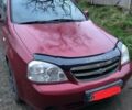 Красный Шевроле Лачетти, объемом двигателя 1.8 л и пробегом 250 тыс. км за 800 $, фото 1 на Automoto.ua