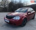 Красный Шевроле Лачетти, объемом двигателя 1.8 л и пробегом 270 тыс. км за 3600 $, фото 1 на Automoto.ua