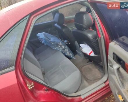 Красный Шевроле Лачетти, объемом двигателя 1.6 л и пробегом 296 тыс. км за 2900 $, фото 6 на Automoto.ua