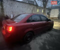 Красный Шевроле Лачетти, объемом двигателя 1.8 л и пробегом 305 тыс. км за 1850 $, фото 2 на Automoto.ua