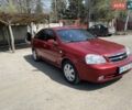 Красный Шевроле Лачетти, объемом двигателя 1.6 л и пробегом 270 тыс. км за 5150 $, фото 1 на Automoto.ua