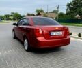 Красный Шевроле Лачетти, объемом двигателя 1.6 л и пробегом 297 тыс. км за 3600 $, фото 4 на Automoto.ua