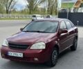 Красный Шевроле Лачетти, объемом двигателя 1.8 л и пробегом 250 тыс. км за 3600 $, фото 1 на Automoto.ua