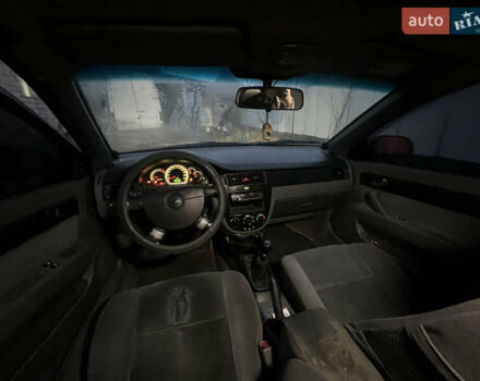 Красный Шевроле Лачетти, объемом двигателя 1.8 л и пробегом 305 тыс. км за 1850 $, фото 11 на Automoto.ua