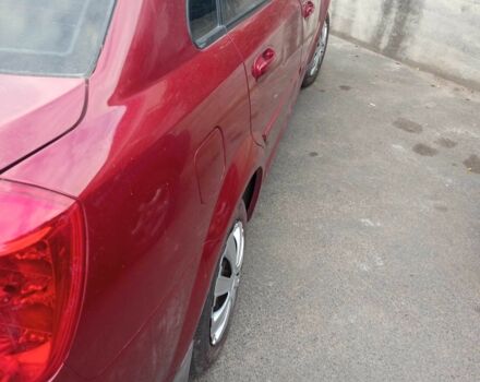 Красный Шевроле Лачетти, объемом двигателя 1.6 л и пробегом 143 тыс. км за 3800 $, фото 5 на Automoto.ua