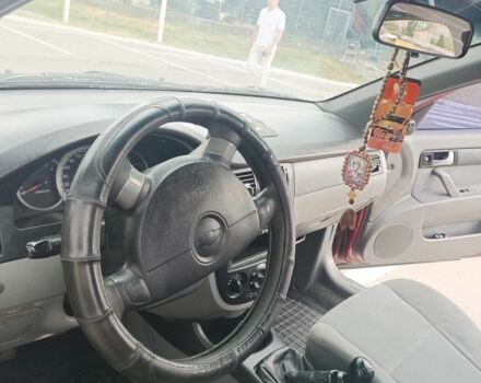 Червоний Шевроле Лачетті, об'ємом двигуна 1.6 л та пробігом 265 тис. км за 3099 $, фото 5 на Automoto.ua