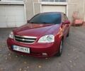 Красный Шевроле Лачетти, объемом двигателя 1.6 л и пробегом 198 тыс. км за 5200 $, фото 1 на Automoto.ua