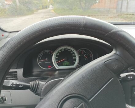 Красный Шевроле Лачетти, объемом двигателя 1.6 л и пробегом 231 тыс. км за 3400 $, фото 5 на Automoto.ua