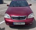 Красный Шевроле Лачетти, объемом двигателя 1.8 л и пробегом 205 тыс. км за 3400 $, фото 1 на Automoto.ua