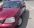 Красный Шевроле Лачетти, объемом двигателя 1.8 л и пробегом 205 тыс. км за 3400 $, фото 1 на Automoto.ua