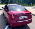 Красный Шевроле Лачетти, объемом двигателя 1.8 л и пробегом 205 тыс. км за 4650 $, фото 2 на Automoto.ua