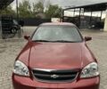 Красный Шевроле Лачетти, объемом двигателя 1.8 л и пробегом 195 тыс. км за 3700 $, фото 2 на Automoto.ua