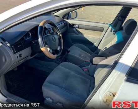 Червоний Шевроле Лачетті, об'ємом двигуна 1.8 л та пробігом 202 тис. км за 3899 $, фото 8 на Automoto.ua