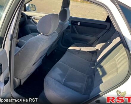 Червоний Шевроле Лачетті, об'ємом двигуна 1.8 л та пробігом 202 тис. км за 3899 $, фото 9 на Automoto.ua