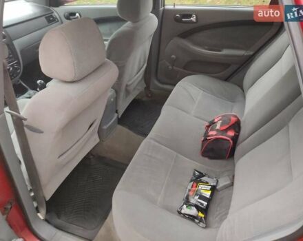 Красный Шевроле Лачетти, объемом двигателя 1.8 л и пробегом 380 тыс. км за 2999 $, фото 6 на Automoto.ua