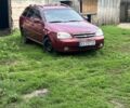 Красный Шевроле Лачетти, объемом двигателя 1.8 л и пробегом 330 тыс. км за 3500 $, фото 1 на Automoto.ua