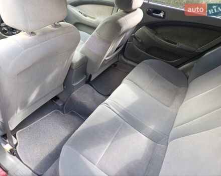 Красный Шевроле Лачетти, объемом двигателя 1.8 л и пробегом 173 тыс. км за 5300 $, фото 3 на Automoto.ua