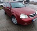 Красный Шевроле Лачетти, объемом двигателя 1.8 л и пробегом 235 тыс. км за 3900 $, фото 1 на Automoto.ua
