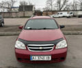 Красный Шевроле Лачетти, объемом двигателя 1.8 л и пробегом 220 тыс. км за 5600 $, фото 1 на Automoto.ua