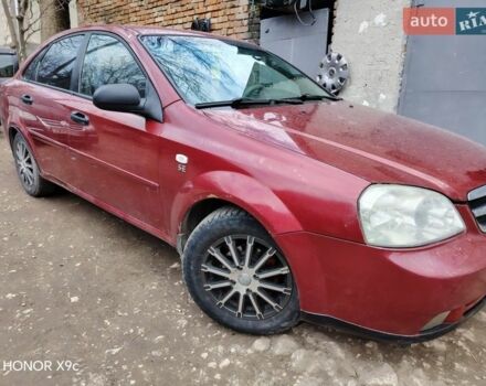 Красный Шевроле Лачетти, объемом двигателя 1.6 л и пробегом 350 тыс. км за 2000 $, фото 1 на Automoto.ua
