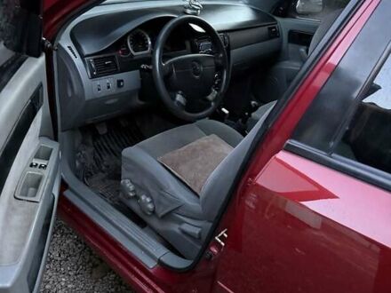 Красный Шевроле Лачетти, объемом двигателя 1.6 л и пробегом 368 тыс. км за 3300 $, фото 1 на Automoto.ua