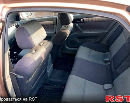 Желтый Шевроле Лачетти, объемом двигателя 1.8 л и пробегом 200 тыс. км за 2300 $, фото 6 на Automoto.ua