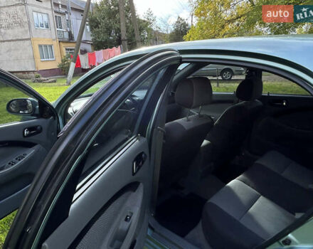 Зелений Шевроле Лачетті, об'ємом двигуна 1.8 л та пробігом 225 тис. км за 3950 $, фото 10 на Automoto.ua