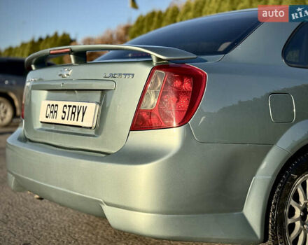 Зелений Шевроле Лачетті, об'ємом двигуна 1.8 л та пробігом 296 тис. км за 4200 $, фото 22 на Automoto.ua